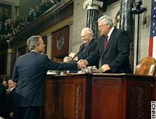 President Bush shakes hands with Vice President Dick Cheney and House Speaker Dennis Hastert before the State of the Union.